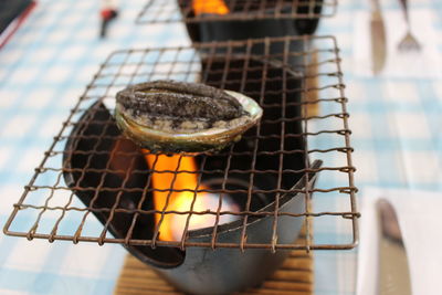 Close-up of meat on barbecue grill