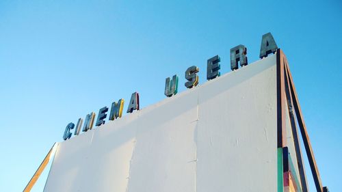 Low angle view of building against clear blue sky