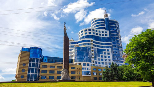 Low angle view of modern buildings against sky