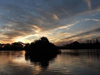 Scenic view of lake against sky during sunset