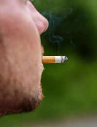 Close-up of cigarette smoking outdoors