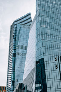 Low angle view of modern buildings against sky