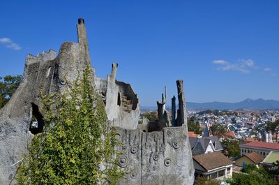 Low angle view of old building against blue sky