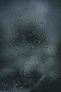 Full frame shot of wet glass window