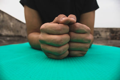 Close-up of person hand on table