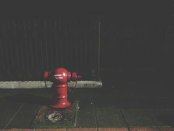 Close-up of fire hydrant against wall