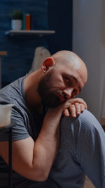 Mid adult man sitting at table