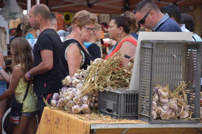 People at market stall in city