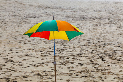 Multi colored umbrella on beach