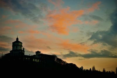 Silhouette of temple against sky during sunset