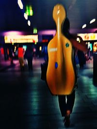 People in illuminated room