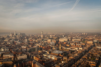 Aerial view of cityscape against sky