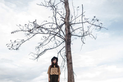 Woman standing on tree