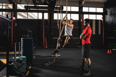 Rear view of woman exercising in gym