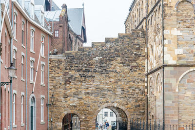 Low angle view of old buildings against sky