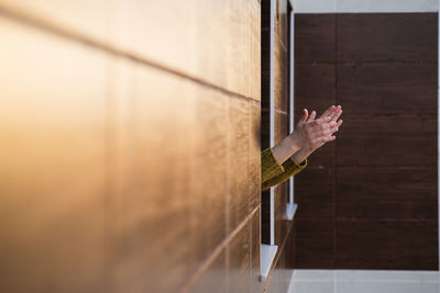 Person hand on glass wall