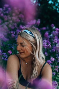 Midsection of woman with purple flower