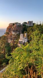 Trees and buildings against sky