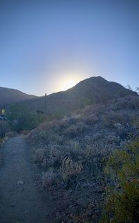 Scenic view of landscape against clear sky during sunset