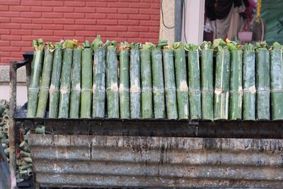 Food in bamboos on barbecue at market