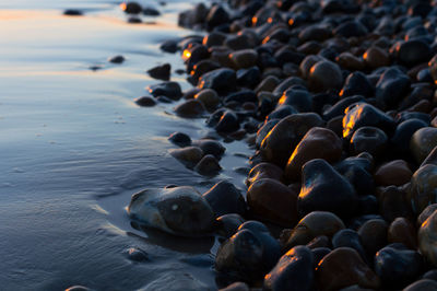 Close-up of pebbles in sea