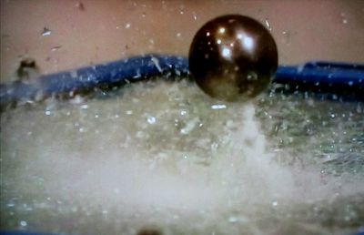 Close-up of water drops on ball