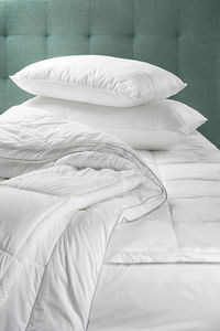 Pillow and duvet on bed