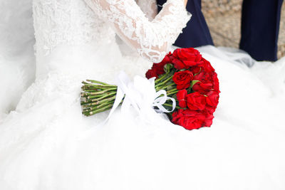 Close-up of flower bouquet against white wall