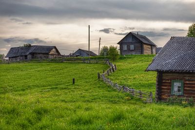 House on field against sky