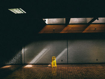 Empty road in tunnel along the wall