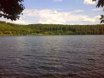 Scenic view of sea against cloudy sky