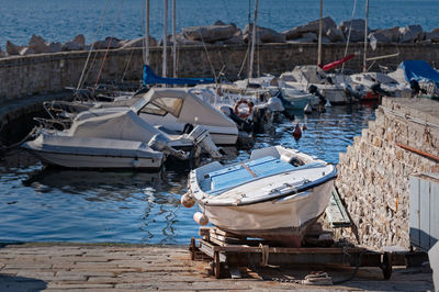 Boats moored at harbor