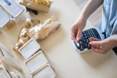 High angle view of woman working on table