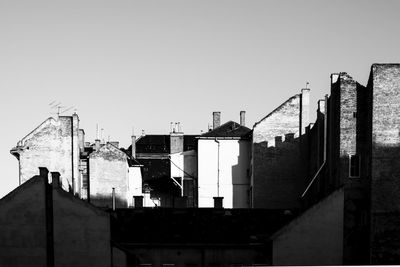 Buildings in city against clear sky