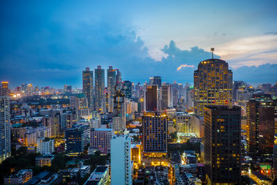 Aerial view of city lit up at night