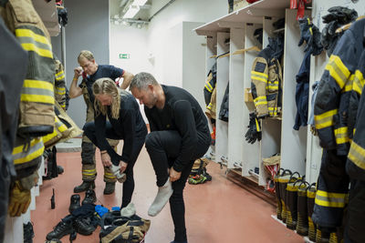 Firefighters changing in locker