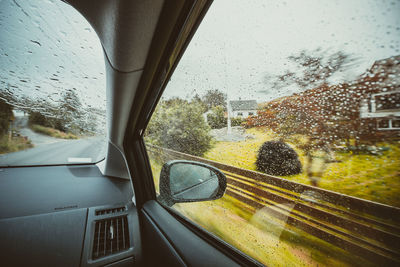 Raindrops on glass window of rainy season