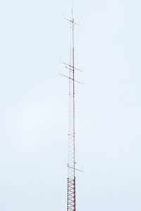 Low angle view of communications tower against clear sky