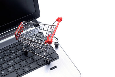 Close-up of coin-operated binoculars against white background