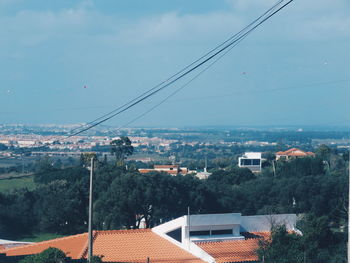 Scenic view of residential district against sky