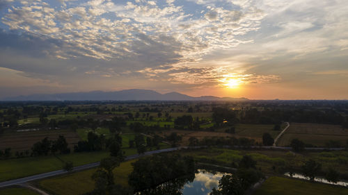 Scenic view of landscape against sky during sunset