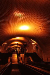 Illuminated tunnel at subway station