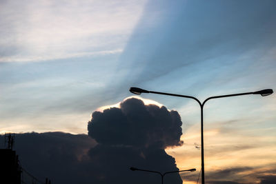 Low angle view of silhouette street light against sky during sunset