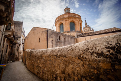 Low angle view of old building against sky