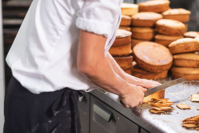 Midsection of man preparing food