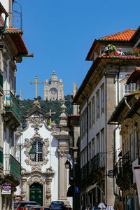 Low angle view of buildings against blue sky