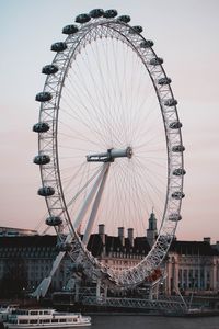 Ferris wheel in city against sky