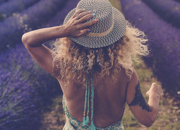 Midsection of woman wearing hat