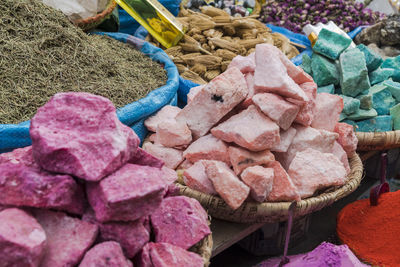 Closeup of spices and colorful minerals at spice store in medina