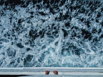 Directly above view of person in boat over sea